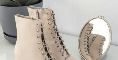 brown leather boots on white table